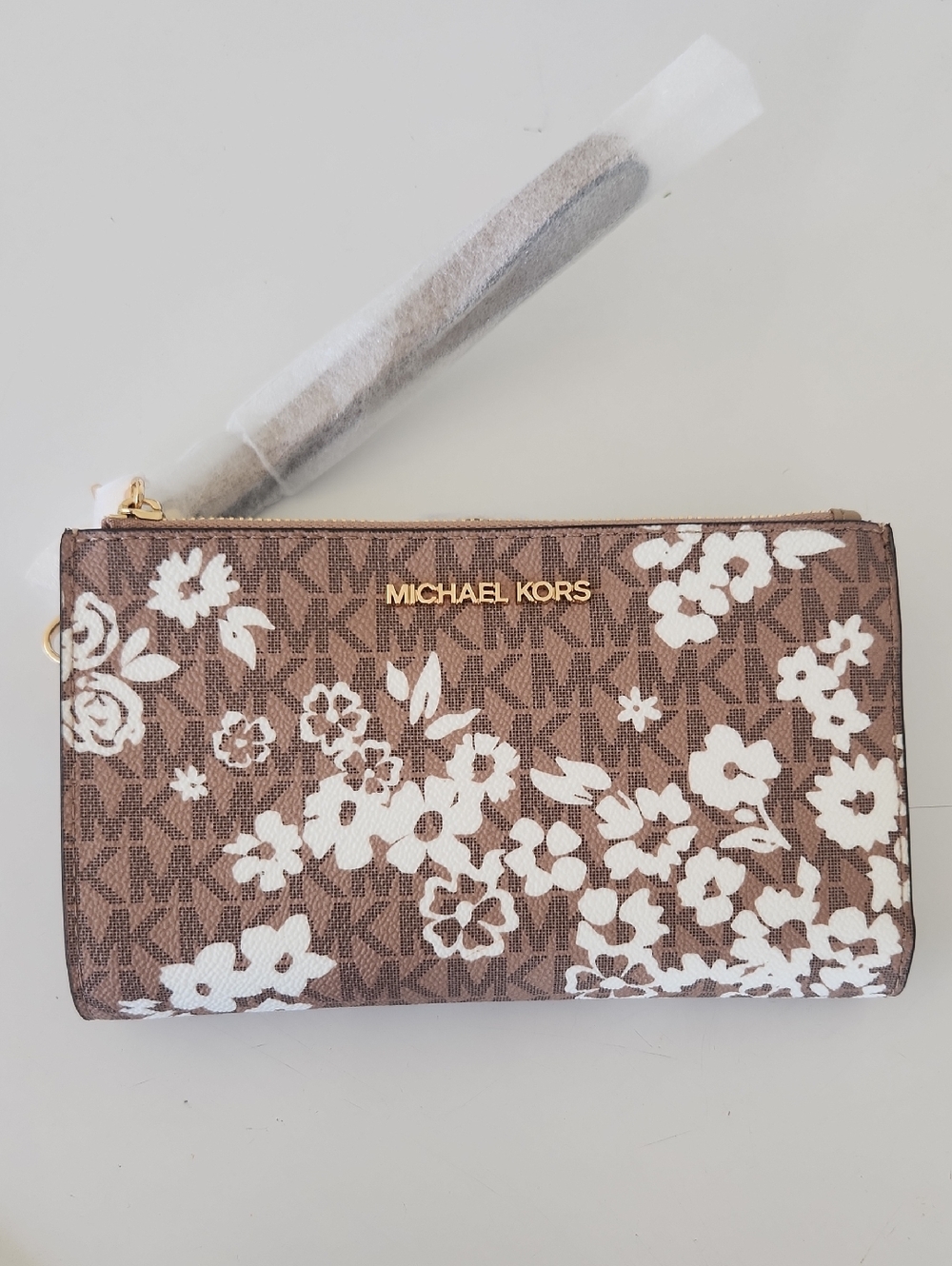 MICHAEL KORS Brown and White Floral Logo Wristlet